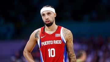 Puerto Rico's #10 Jose Alvarado reacts at the end of the men's preliminary round group C basketball match between South Sudan and Puerto Rico during the Paris 2024 Olympic Games at the Pierre-Mauroy stadium in Villeneuve-d'Ascq, northern France, on July 28, 2024. (Photo by Sameer Al-Doumy / AFP)
