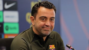 Barcelona's Spanish coach Xavi addresses a press conference at the Joan Gamper training ground in Sant Joan Despi, near Barcelona, on April 25, 2024. Xavi will remain as coach of Barcelona, the Spanish giants told AFP on April 24, despite having announced in January that he planned to quit at the end of the season due to the "cruel and unpleasant" nature of the job. (Photo by LLUIS GENE / AFP)