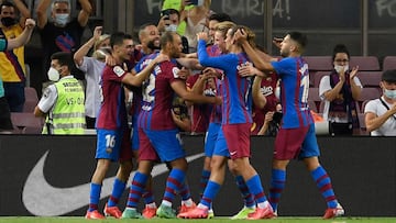 Barcelona&#039;s Danish forward Martin Braithwaite (3L) celebrates with teammates after scoring during the Spanish League football match between Barcelona and Real Sociedad at the Camp Nou stadium in Barcelona on August 15, 2021. (Photo by Josep LAGO / AF