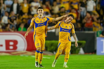 Tigres' Argentine midfielder #11 Juan Brunetta celebrates with teammate Uruguayan midfielder #08 Fernando Gorriaran after scoring his team's first goal during the Liga MX Apertura tournament football match between Tigres and Pachuca at the Universitario (UANL) Stadium in San Nicolas de los Garza, Nuevo Leon State, Mexico, on October 26, 2024. (Photo by Julio Cesar AGUILAR / AFP)