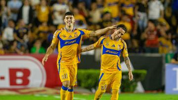 Tigres' Argentine midfielder #11 Juan Brunetta celebrates with teammate Uruguayan midfielder #08 Fernando Gorriaran after scoring his team's first goal during the Liga MX Apertura tournament football match between Tigres and Pachuca at the Universitario (UANL) Stadium in San Nicolas de los Garza, Nuevo Leon State, Mexico, on October 26, 2024. (Photo by Julio Cesar AGUILAR / AFP)