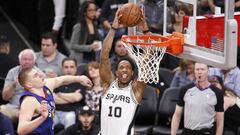 Apr 18, 2019; San Antonio, TX, USA; San Antonio Spurs shooting guard DeMar DeRozan (10) dunks the ball past Denver Nuggets center Nikola Jokic (15) in game three of the first round of the 2019 NBA Playoffs at AT&amp;T Center. Mandatory Credit: Soobum Im-USA TODAY Sports