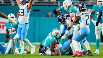 MIAMI GARDENS, FLORIDA - DECEMBER 11: Harold Landry III #58 of the Tennessee Titans sacks Tua Tagovailoa #1 of the Miami Dolphins in the fourth quarter at Hard Rock Stadium on December 11, 2023 in Miami Gardens, Florida. Rich Storry/Getty Images/AFP (Photo by Rich Storry / GETTY IMAGES NORTH AMERICA / Getty Images via AFP)