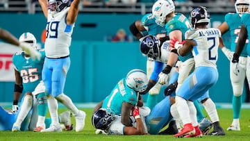 MIAMI GARDENS, FLORIDA - DECEMBER 11: Harold Landry III #58 of the Tennessee Titans sacks Tua Tagovailoa #1 of the Miami Dolphins in the fourth quarter at Hard Rock Stadium on December 11, 2023 in Miami Gardens, Florida.   Rich Storry/Getty Images/AFP (Photo by Rich Storry / GETTY IMAGES NORTH AMERICA / Getty Images via AFP)