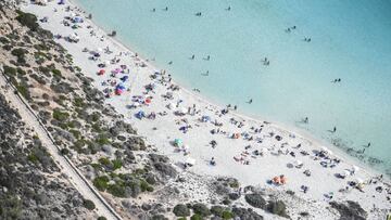 LAMPEDUSA, ITALY - AUGUST 04: Aerial view of the rabbit island beach in Lampedusa full of tourists on holiday on August 04, 2020 in Lampedusa, Italy. The Italian island has reportedly run out of room to quarantine migrants, as is required as part of Italy's anti-coronavirus measures. (Photo by Fabrizio Villa/Getty Images)
