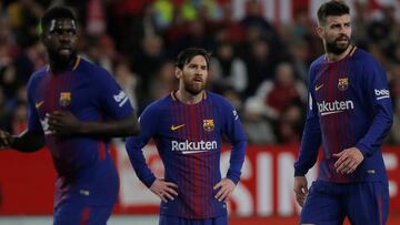 Soccer Football - La Liga Santander - Sevilla vs Barcelona - Ramon Sanchez Pizjuan, Seville, Spain - March 31, 2018 Barcelona's Lionel Messi, Gerard Pique and Samuel Umtiti REUTERS/Jon Nazca