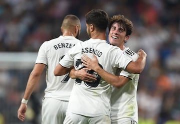 Marco Asensio of Real Madrid celebrates with Alvaro Odriozola.