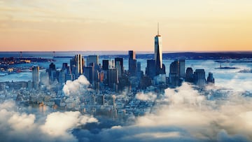 View of Lower Manhattan, the financial district and One World Trade Centre with clouds at sunset. New York City