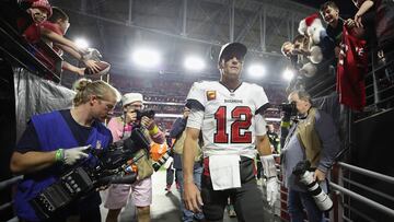 (FILES) In this file photo taken on December 25, 2022, Quarterback Tom Brady of the Tampa Bay Buccaneers walks off the field following the NFL game at State Farm Stadium in Glendale, Arizona. - Brady announced his retirement on February 1, 2023, at the age of 45 after a storied career that included a record-breaking seventh Super Bowl victory in 2021 and a temporary retirement last year. "I'll get to the point right away: I'm retiring, for good," Brady said in a social media video. (Photo by Christian Petersen / GETTY IMAGES NORTH AMERICA / AFP)