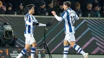 Real Sociedad's Japanese forward #14 Takefusa Kubo (l) celebrates scoring during the UEFA Europa League knockout round play-off first leg football match between FC Midtjylland and Real Sociedad de Futbol in Herning, Denmark on February 13, 2025. (Photo by Henning Bagger / Ritzau Scanpix / AFP) / Denmark OUT