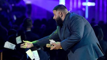 (FILES) In this file photo taken on August 25, 2020 DJ Khaled throws money to the crowd during a performance by Jennifer Lopez during the 2018 Billboard Music Awards at MGM Grand Garden Arena in Las Vegas, Nevada. - Amazon on September 16, 2020 added podc