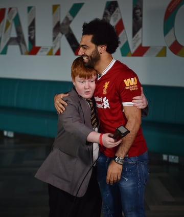 Mohamed Salah of Liverpool surprising school children for a 'Kop Kids' episode at Anfield, Liverpool, England.