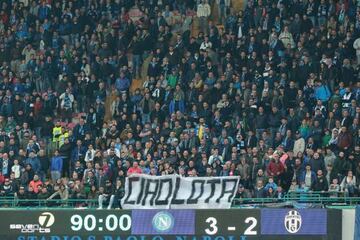 Napoli's supporters hold a banner reading "bye bye mud. "