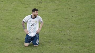 Argentina's Lionel Messi kneels on the grass during a Copa America quarterfinal soccer match against Venezuela at the Maracana stadium in Rio de Janeiro, Brazil, Friday, June 28, 2019. (AP Photo/Silvia Izquierdo)