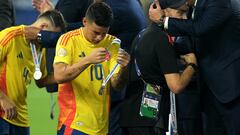 Colombia's midfielder #10 James Rodriguez takes off his medal following his team's defeat in the Conmebol 2024 Copa America tournament final football match between Argentina and Colombia at the Hard Rock Stadium, in Miami, Florida on July 14, 2024. (Photo by JUAN MABROMATA / AFP)