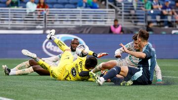 Aug 3, 2025; Seattle, WA, USA; Santos Laguna defender Haret Ortega (19, second from right), scores an own goal against goalkeeper Hector Holguin Perez (33) during the first half at Lumen Field. Seattle Sounders FC forward Danny Musovski (19, right) follows the play at right. Mandatory Credit: Joe Nicholson-Imagn Images