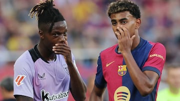 Athletic Bilbao's Spanish forward #10 Nico Williams (L) and Barcelona's Spanish forward #19 Lamine Yamal talk together during the Spanish league football match between FC Barcelona and Athletic Club Bilbao at the Estadi Olimpic Lluis Companys in Barcelona on August 24, 2024. (Photo by LLUIS GENE / AFP)