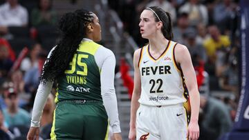 INDIANAPOLIS, INDIANA - MAY 30: Caitlin Clark #22 of the Indiana Fever exchanges words with Victoria Vivians #35 of the Seattle Storm during the first quarter in the game at Gainbridge Fieldhouse on May 30, 2024 in Indianapolis, Indiana. NOTE TO USER: User expressly acknowledges and agrees that, by downloading and or using this photograph, User is consenting to the terms and conditions of the Getty Images License Agreement.   Andy Lyons/Getty Images/AFP (Photo by ANDY LYONS / GETTY IMAGES NORTH AMERICA / Getty Images via AFP)