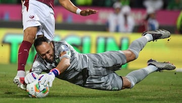 Nacional's goalkeeper #01 David Ospina and Tolima's midfielder #10 Yeison Guzman fight for the ball during the Colombian League second leg football final match between Atletico Nacional and Deportes Tolima at the Atanasio Girardot Stadium in Medellin, Colombia on December 22, 2024. (Photo by Jaime SALDARRIAGA / AFP)