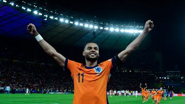 Netherlands' forward #11 Cody Gakpo celebrates after the UEFA Euro 2024 quarter-final football match between the Netherlands and Turkey at the Olympiastadion in Berlin on July 6, 2024. (Photo by JOHN MACDOUGALL / AFP)