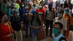 Passengers wearing protective masks wait to board a metro train on the first day of the restart of the metro operations, amidst the spread of the coronavirus disease (COVID-19), in Kolkata, India, September 14, 2020. REUTERS/Rupak De Chowdhuri