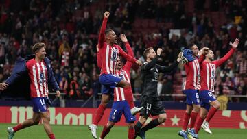 Atletico players celebrate their win at the end of the Spanish league football match between Club Atletico de Madrid and Villarreal CF at the Civitas Metropolitano stadium in Madrid on November 12, 2023. (Photo by Thomas COEX / AFP)