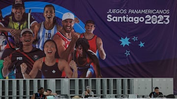 Accredited journalists work in the at the Media Press Center (MPC) at the National Stadium in Santiago on October 16, 2013. The new National Stadium Sports Park was built around the existing National Stadium and includes 11 other new or renovated venues that will host sports such as athletics, field hockey, skating, swimming and tennis. The Pan-American Games will run from October 20 to November 5. (Photo by MARTIN BERNETTI / AFP)