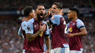 Aston Villa's Brazilian midfielder #06 Douglas Luiz (2L) celebrates with teammates after scoring the opening goal of the English Premier League football match between Aston Villa and West Ham United at Villa Park in Birmingham, central England on October 22, 2023. (Photo by JUSTIN TALLIS / AFP) / RESTRICTED TO EDITORIAL USE. No use with unauthorized audio, video, data, fixture lists, club/league logos or 'live' services. Online in-match use limited to 120 images. An additional 40 images may be used in extra time. No video emulation. Social media in-match use limited to 120 images. An additional 40 images may be used in extra time. No use in betting publications, games or single club/league/player publications. / 