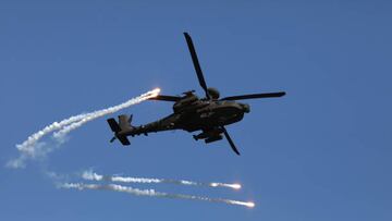YEOJU-GUN, SOUTH KOREA - OCTOBER 19: An AH64 Apache helicopter flies over a floating bridge set up across the Nam Han River during a river crossing exercise on October 19, 2022 in Yeoju, South Korea. North Korea's military said Wednesday it fired artillery shots overnight into maritime buffer zones near the inter-Korean border as a "serious warning" over South Korea's ongoing military drills. The Korean peninsula is the world's last Cold War frontier as stalinist North Korea and pro-western South Korea have been technically at war since the 1950-53 conflict. (Photo by Chung Sung-Jun/Getty Images)