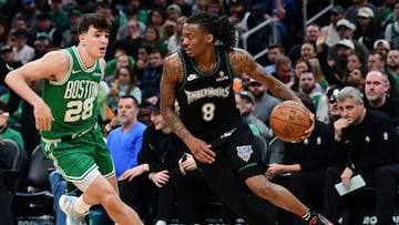 Minnesota Timberwolves guard Bones Hyland (8) controls the ball while Boston Celtics guard Hugo Gonzalez (28) defends during the second half at TD Garden.