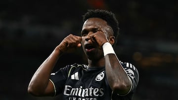 Real Madrid's Brazilian forward #07 Vinicius Junior celebrates scoring the opening goal during the UEFA Champions League, round of 16 second leg football match between Manchester City and Real Madrid at the Etihad Stadium in Manchester, north west England, on March 17, 2026. (Photo by Paul ELLIS / AFP)