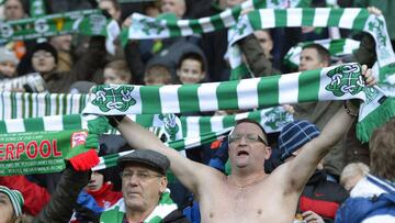 A Celtic supporter sings 'You'll Never Walk alone' during their Scottish Premier League soccer match against Hearts at Celtic Park Stadium in Glasgow, Scotland January 19, 2013. REUTERS/Russell Cheyne (BRITAIN - Tags: SPORT SOCCER)