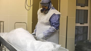 A member of the Muslim burial organization waits to prepare the body of a man who died due to the coronavirus disease (COVID-19) for burial at Ghiedmatiel Islamia mosque in Cape Town, South Africa, July 31, 2020. Picture taken July 31, 2020. REUTERS/Sumay