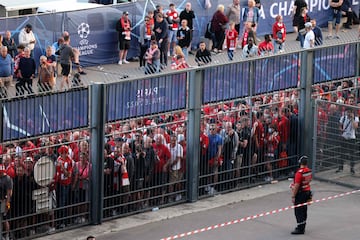 Liverpool fans stand outside unable to get in in time leading to the match being delayed prior to the UEFA Champions League 