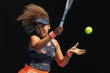 Naomi Osaka hits a return against Taiwan's Hsieh Su-wei.