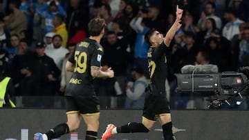 Genoa's Medicano defender #22 Johan Vasquez (R) celebrates with a teammate after scoring a goal during the Italian Serie A football match between SSC Napoli and Genoa CFC at the Diego Armando Maradona Stadium in Naples on May 11, 2025. (Photo by CARLO HERMANN / AFP)