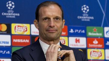 Juventus coach Massimiliano Allegri adjusts his tie at the start of a press conference at the Johan Cruyff ArenA in Amsterdam, Netherlands, Tuesday, April 9, 2019. (AP Photo/Peter Dejong)