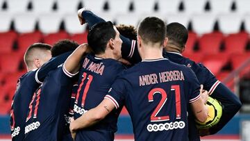 Paris' players celebrate after scoring a goal during the French L1 football match between Paris-Saint Germain (PSG) and RC Strasbourg (RCSA) at The Parc des Princes Stadium in Paris, on December 23, 2020. (Photo by STEPHANE DE SAKUTIN / AFP)