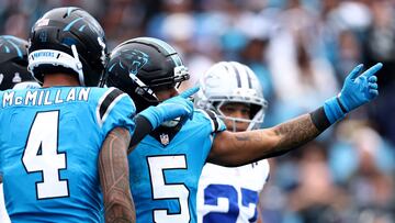 CHARLOTTE, NORTH CAROLINA - OCTOBER 12: Rico Dowdle #5 of the Carolina Panthers reacts after a first down during the third quarter against the Dallas Cowboys in the game at Bank of America Stadium on October 12, 2025 in Charlotte, North Carolina. Jared C. Tilton/Getty Images/AFP (Photo by Jared C. Tilton / GETTY IMAGES NORTH AMERICA / Getty Images via AFP)