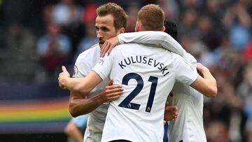 Tottenham Hotspur's English striker Harry Kane (L), Tottenham Hotspur's Swedish midfielder Dejan Kulusevski (C) and Tottenham Hotspur's South Korean striker Son Heung-Min (R) celebrate their win on the pitch after the English Premier League