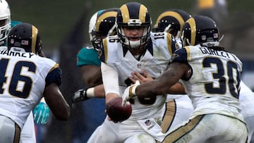 Nov 20, 2016; Los Angeles, CA, USA; Los Angeles Rams quarterback Jared Goff (16) hands off the ball to running back Todd Gurley (30) during the Rams' 14-10 loss to at Los Angeles Memorial Coliseum. Mandatory Credit: Robert Hanashiro-USA TODAY Sports