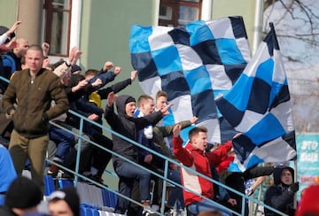 Soccer Football - Vysheyshaya Liga - Slutsk v Slavia-Mozyr - Stadyen Haradski, Barysaw, Belarus - March 22, 2020 Fans wave flags as the match goes ahead despite most sport being cancelled around the world as the spread of coronavirus disease (COVID-19) co