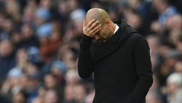 Manchester City's Spanish manager Pep Guardiola reacts