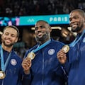 TOPSHOT - Gold medallists (From L) USA's #04 Stephen Curry, USA's #06 LeBron James and USA's #07 Kevin Durant pose after the men's Gold Medal basketball match between France and USA during the Paris 2024 Olympic Games at the Bercy Arena in Paris on August 10, 2024. (Photo by Damien MEYER / AFP)
