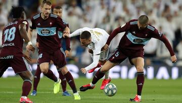 MADRID, SPAIN - FEBRUARY 16: Eden Hazard of Real Madrid is tackled by Okay Yokuslu of Celta Vigo during the La Liga match between Real Madrid CF and RC Celta de Vigo at Estadio Santiago Bernabeu on February 16, 2020 in Madrid, Spain. (Photo by Angel Martinez/Getty Images)