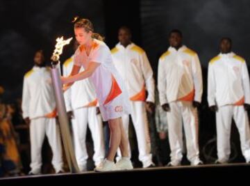 The Pan American Games Torch arrives during the opening ceremony for the 2015 Pan American Games at the Rogers Centre in Toronto, Ontario, on July 10, 2015. AFP PHOTO/HECTOR RETAMAL