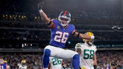 EAST RUTHERFORD, NEW JERSEY - DECEMBER 11: Saquon Barkley #26 of the New York Giants celebrates after scoring a five yard touchdown against the Green Bay Packers during the second quarter in the game at MetLife Stadium on December 11, 2023 in East Rutherford, New Jersey.   Sarah Stier/Getty Images/AFP (Photo by Sarah Stier / GETTY IMAGES NORTH AMERICA / Getty Images via AFP)