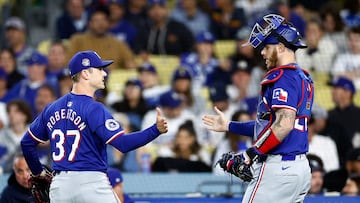 LOS ANGELES, CALIFORNIA - JUNE 13: David Robertson #37 and Jonah Heim #28 of the Texas Rangers after the third out against the Los Angeles Dodgers in the eighth inning at Dodger Stadium on June 13, 2024 in Los Angeles, California. Ronald Martinez/Getty Images/AFP (Photo by RONALD MARTINEZ / GETTY IMAGES NORTH AMERICA / Getty Images via AFP)