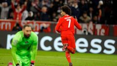 Bayern Munich's German midfielder Serge Gnabry (R) celebrates after scoring the 2-0 goal during the UEFA Champions League round of 16, 2nd-leg football match FC Bayern Munich v Paris Saint-Germain FC in Munich, southern Germany, on March 8, 2023. (Photo by Odd ANDERSEN / AFP)