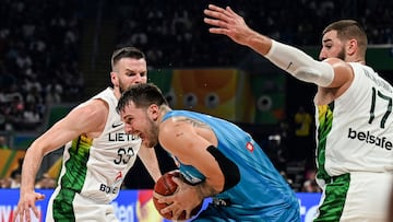 Luka Doncic holds the ball during the FIBA Basketball World Cup classification match between Slovenia and Lithuania.